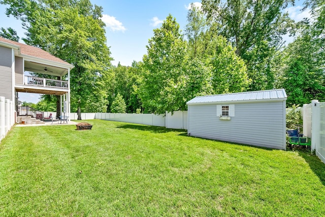258 Bellshire Dr, Clarksville, TN 37043 - view of yard with an outdoor fire pit, ceiling fan, an outdoor structure, and a patio