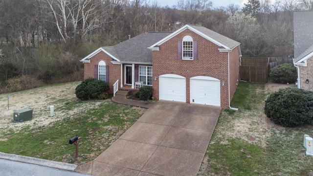 214 Cobblestone Lndg, Mount Juliet, TN 37122 - view of front facade with brick siding, driveway, an attached garage, and a shingled roof