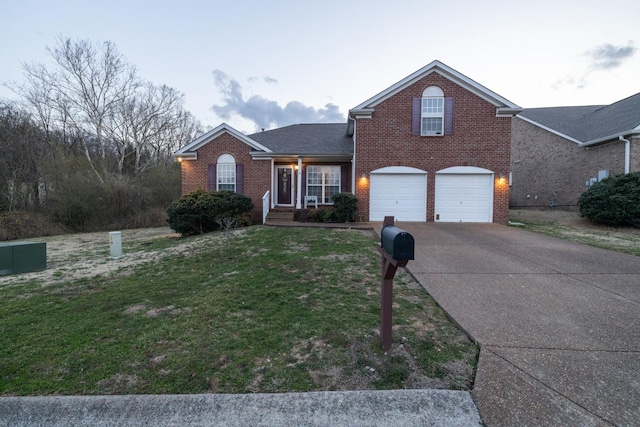 214 Cobblestone Lndg, Mount Juliet, TN 37122 - traditional-style home with brick siding, concrete driveway, an attached garage, and a front lawn