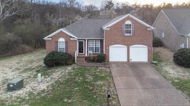 214 Cobblestone Lndg, Mount Juliet, TN 37122 - traditional-style home with brick siding, an attached garage, driveway, and a front yard
