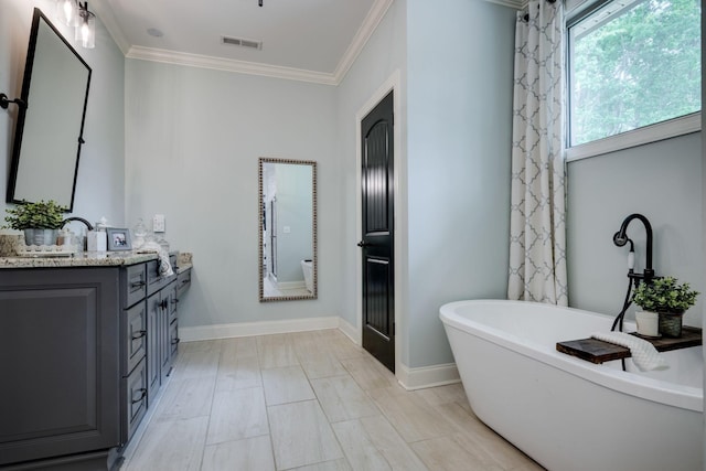 1092 Meeks Cemetery Rd, Burns, TN 37029 - bathroom featuring a freestanding tub, ornamental molding, vanity, and baseboards