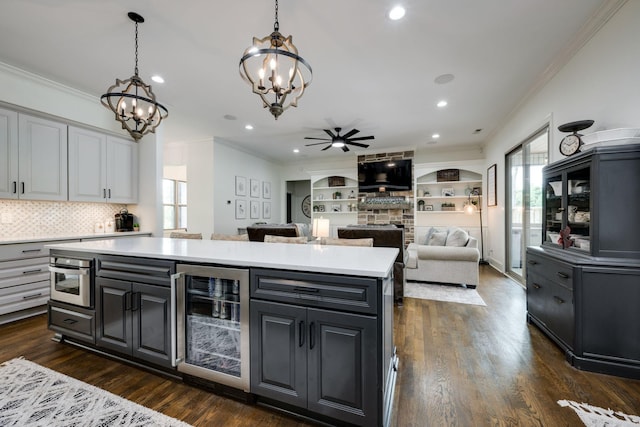 1092 Meeks Cemetery Rd, Burns, TN 37029 - kitchen with wine cooler, a chandelier, healthy amount of natural light, light countertops, and ornamental molding