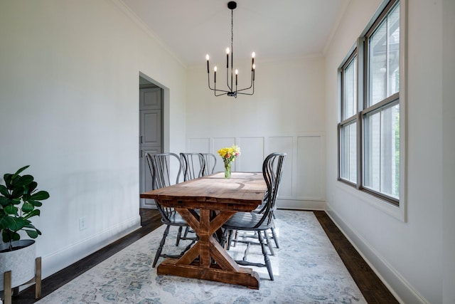 1092 Meeks Cemetery Rd, Burns, TN 37029 - dining space featuring a chandelier, plenty of natural light, ornamental molding, and dark wood-type flooring