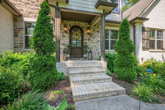 1092 Meeks Cemetery Rd, Burns, TN 37029 - view of exterior entry with stone siding and covered porch