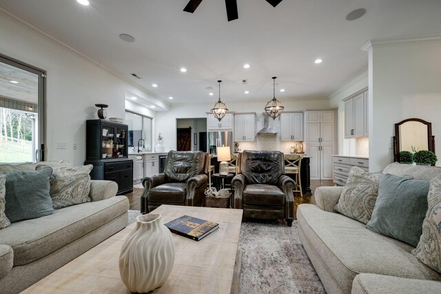 1092 Meeks Cemetery Rd, Burns, TN 37029 - living room with ornamental molding, recessed lighting, ceiling fan, and light wood-type flooring