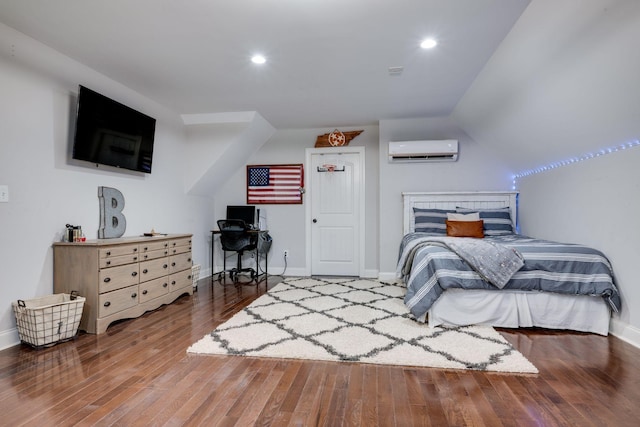 1092 Meeks Cemetery Rd, Burns, TN 37029 - bedroom featuring an AC wall unit, wood finished floors, baseboards, and recessed lighting