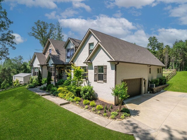 1092 Meeks Cemetery Rd, Burns, TN 37029 - craftsman-style house featuring driveway, brick siding, a garage, and a shingled roof