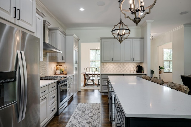 1092 Meeks Cemetery Rd, Burns, TN 37029 - kitchen with stainless steel appliances, a chandelier, a center island, dark wood-style floors, and plenty of natural light