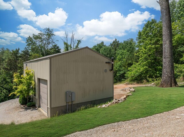 1092 Meeks Cemetery Rd, Burns, TN 37029 - view of side of home with an outbuilding, a yard, and a garage