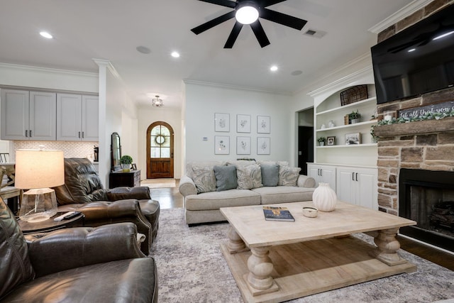 1092 Meeks Cemetery Rd, Burns, TN 37029 - living room featuring a ceiling fan, ornamental molding, wood finished floors, a fireplace, and recessed lighting