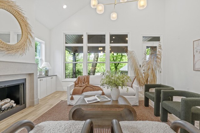 1438 Janie Ave, Nashville, TN 37216 - living area featuring high vaulted ceiling, light wood-style floors, a fireplace, and recessed lighting