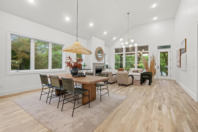 1438 Janie Ave, Nashville, TN 37216 - dining space featuring high vaulted ceiling, light wood-style floors, baseboards, a fireplace, and recessed lighting
