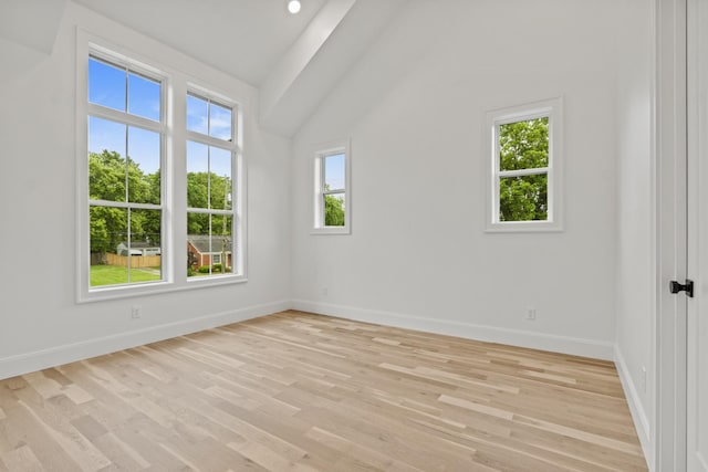 1438 Janie Ave, Nashville, TN 37216 - unfurnished room featuring lofted ceiling, baseboards, and light wood-type flooring