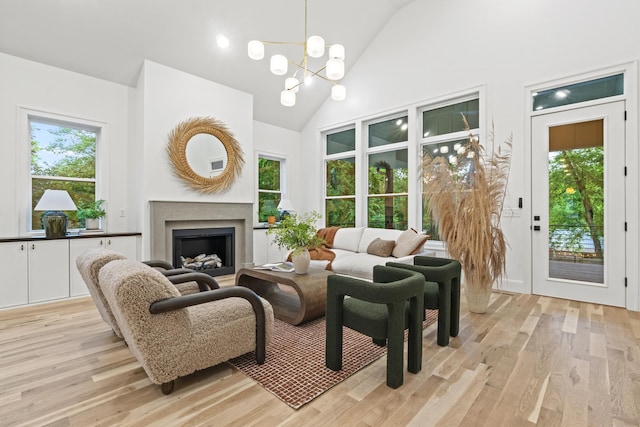 1438 Janie Ave, Nashville, TN 37216 - living room with light wood-style flooring, a fireplace, healthy amount of natural light, and high vaulted ceiling