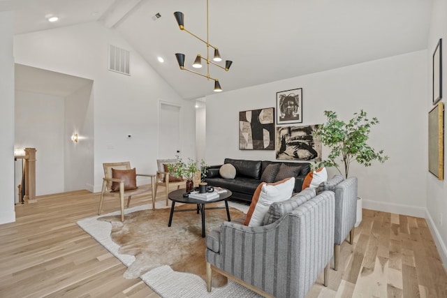 1438 Janie Ave, Nashville, TN 37216 - living room with high vaulted ceiling, light wood finished floors, beam ceiling, baseboards, and a chandelier