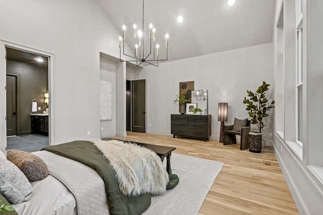 1438 Janie Ave, Nashville, TN 37216 - bedroom featuring high vaulted ceiling, light wood-type flooring, a chandelier, and baseboards