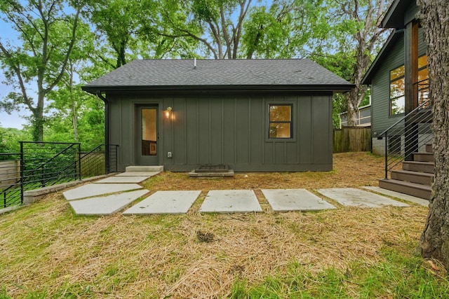 1438 Janie Ave, Nashville, TN 37216 - back of house with board and batten siding, roof with shingles, and entry steps