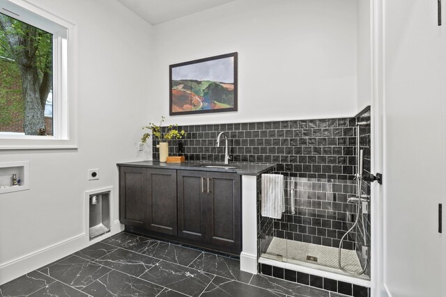 1438 Janie Ave, Nashville, TN 37216 - laundry room featuring electric dryer hookup, dark marble finish floors, and baseboards