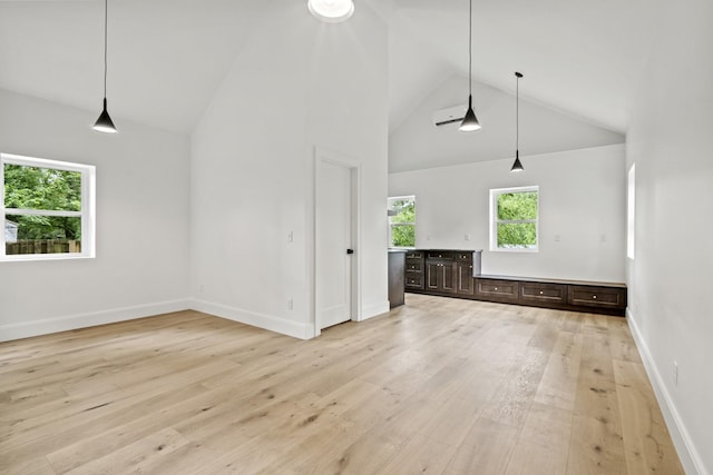 1438 Janie Ave, Nashville, TN 37216 - unfurnished living room with light wood-style floors, baseboards, and high vaulted ceiling