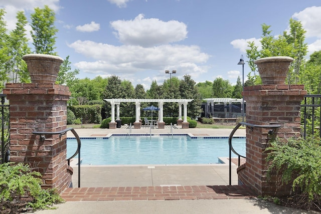 118 Jasper Ave, Franklin, TN 37064 - community pool with a pergola, a patio area, and view of wooded area