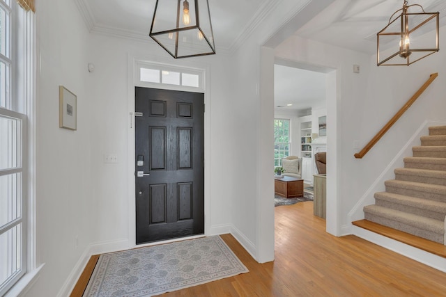 118 Jasper Ave, Franklin, TN 37064 - foyer entrance with a chandelier, stairway, wood finished floors, baseboards, and crown molding