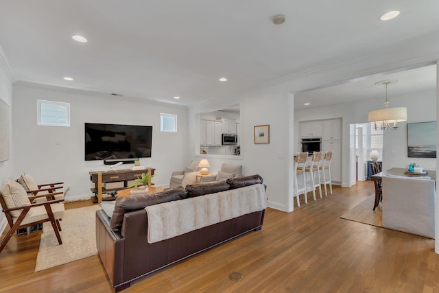 118 Jasper Ave, Franklin, TN 37064 - living area featuring crown molding, healthy amount of natural light, wood finished floors, baseboards, and recessed lighting