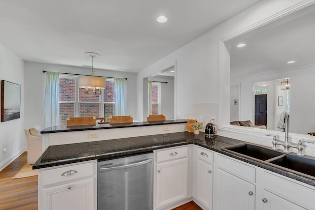 118 Jasper Ave, Franklin, TN 37064 - kitchen featuring stainless steel dishwasher, a sink, a peninsula, dark stone counters, and white cabinets