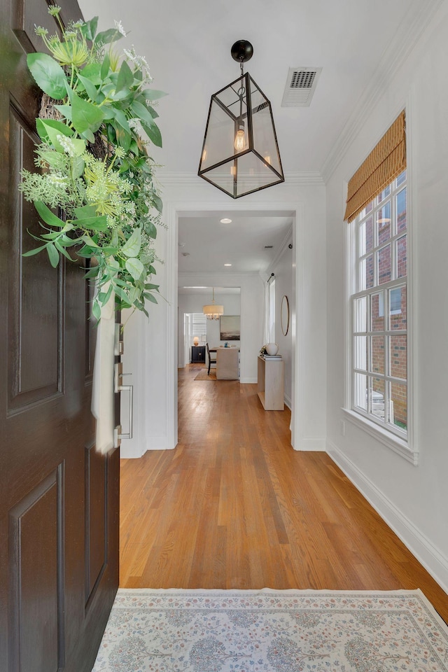 118 Jasper Ave, Franklin, TN 37064 - foyer entrance with baseboards, light wood finished floors, crown molding, and a chandelier