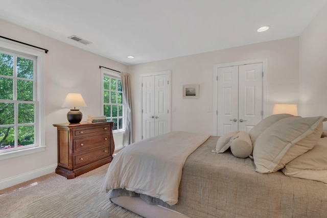 118 Jasper Ave, Franklin, TN 37064 - bedroom featuring two closets, baseboards, light carpet, and recessed lighting