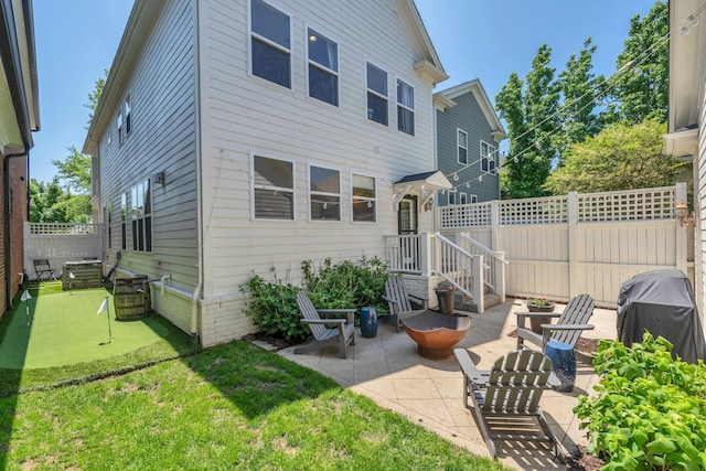 118 Jasper Ave, Franklin, TN 37064 - back of house featuring an area to practice putting, a patio, and a fenced backyard