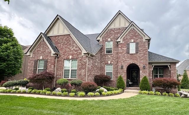 1812 Fairhaven Ln, Murfreesboro, TN 37128 - view of front facade with a front yard, brick siding, and roof with shingles