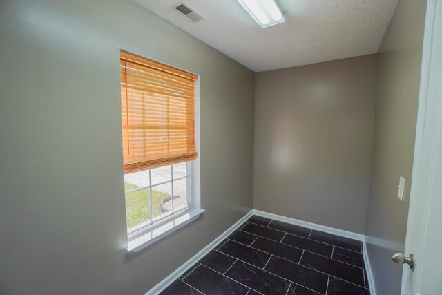 1009 Monticello Pl, Gallatin, TN 37066 - spare room with baseboards and a textured ceiling