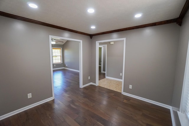1009 Monticello Pl, Gallatin, TN 37066 - spare room featuring ornamental molding, dark wood-type flooring, ceiling fan, recessed lighting, and baseboards