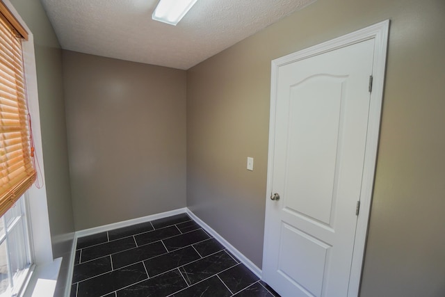 1009 Monticello Pl, Gallatin, TN 37066 - unfurnished room with a textured ceiling and baseboards