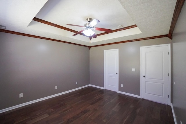 1009 Monticello Pl, Gallatin, TN 37066 - unfurnished bedroom featuring a tray ceiling, dark wood finished floors, baseboards, ornamental molding, and a ceiling fan