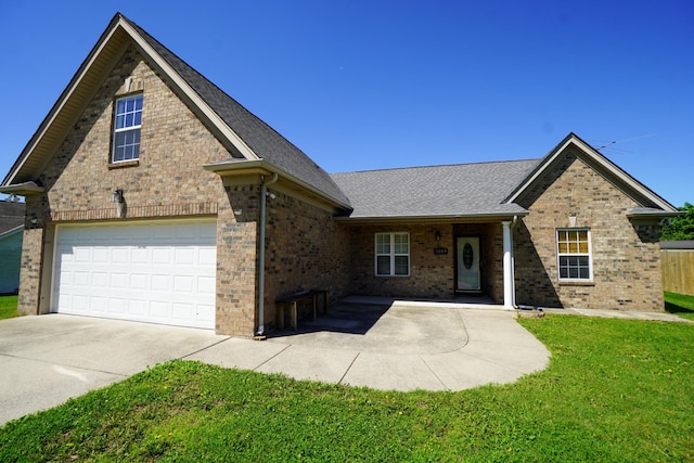 1009 Monticello Pl, Gallatin, TN 37066 - view of front of property featuring brick siding, driveway, a front lawn, an attached garage, and a shingled roof