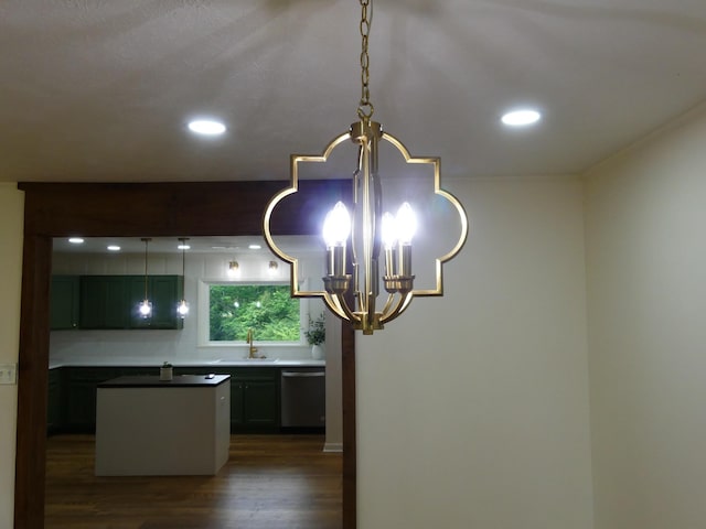 205 W 5th St, Parsons, TN 38363 - kitchen view of stainless steel dishwasher, a chandelier, dark wood-style floors, a sink, and recessed lighting