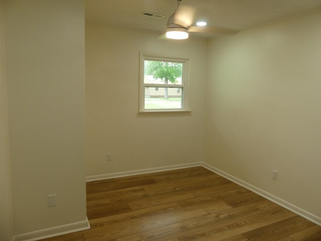 205 W 5th St, Parsons, TN 38363 - spare room with baseboards, wood finished floors, and ceiling fan