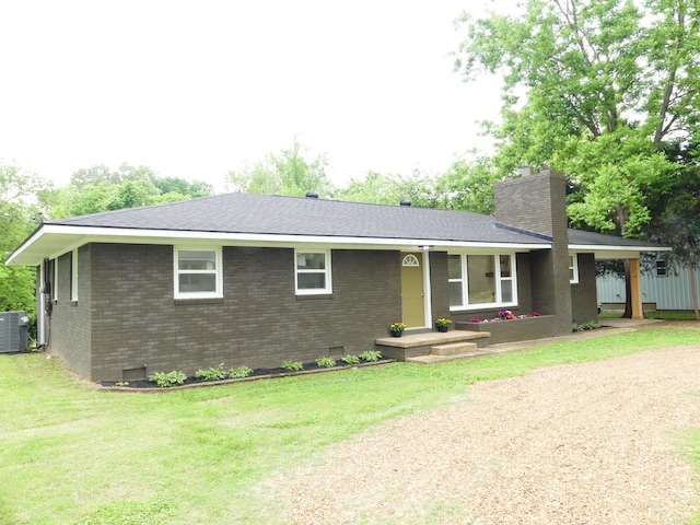 205 W 5th St, Parsons, TN 38363 - ranch-style home featuring brick siding, a chimney, crawl space, a front yard, and roof with shingles