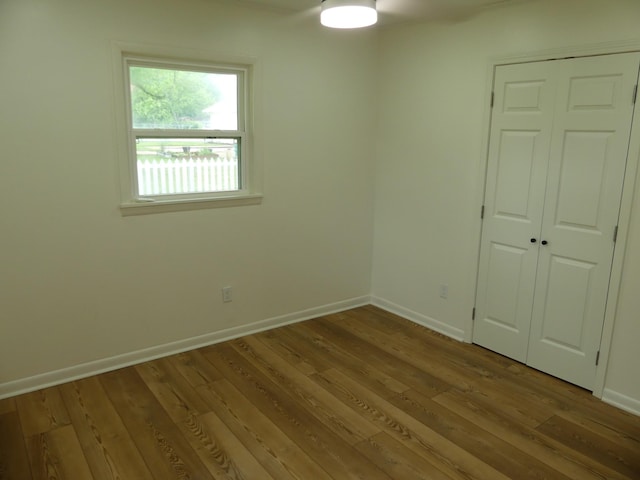 205 W 5th St, Parsons, TN 38363 - spare room with wood finished floors and baseboards