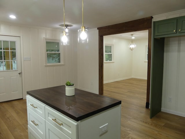 205 W 5th St, Parsons, TN 38363 - kitchen featuring light wood finished floors, wood counters, pendant lighting, and recessed lighting