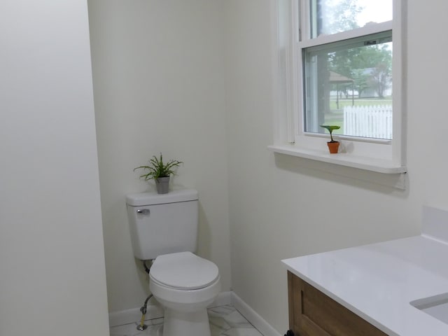 205 W 5th St, Parsons, TN 38363 - bathroom featuring toilet, baseboards, vanity, and marble finish floors