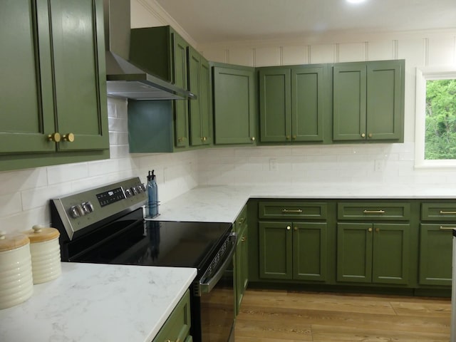 205 W 5th St, Parsons, TN 38363 - kitchen with green cabinetry, stainless steel range with electric cooktop, and wall chimney exhaust hood