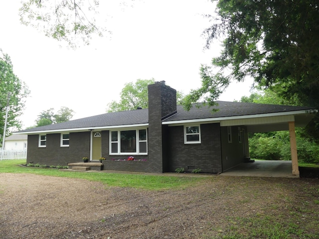 205 W 5th St, Parsons, TN 38363 - ranch-style house with a chimney, an attached carport, crawl space, and brick siding
