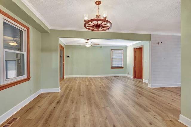 33 Edgewood Rd, Alexandria, TN 37012 - unfurnished room featuring a textured ceiling, light wood-style floors, a chandelier, crown molding, and a ceiling fan