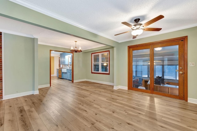 33 Edgewood Rd, Alexandria, TN 37012 - unfurnished living room with a chandelier, ceiling fan, baseboards, a textured ceiling, and light wood-type flooring