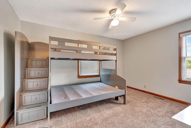 33 Edgewood Rd, Alexandria, TN 37012 - carpeted bedroom with a textured ceiling and baseboards