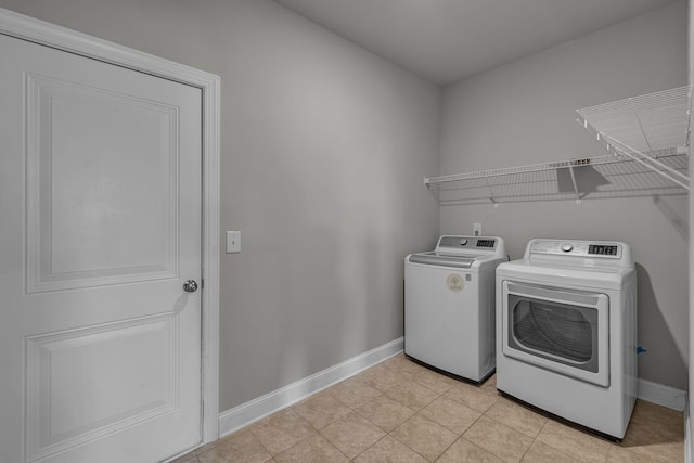 1010 Keeneland Dr, Spring Hill, TN 37174 - laundry room with washer and clothes dryer and baseboards