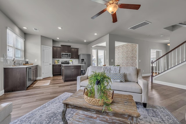 1010 Keeneland Dr, Spring Hill, TN 37174 - living area featuring ceiling fan, baseboards, light wood-style floors, recessed lighting, and stairs