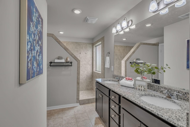 1010 Keeneland Dr, Spring Hill, TN 37174 - bathroom with a walk in shower, tile patterned flooring, double vanity, recessed lighting, and baseboards